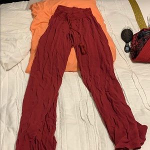 Dark maroon flowy pants.
